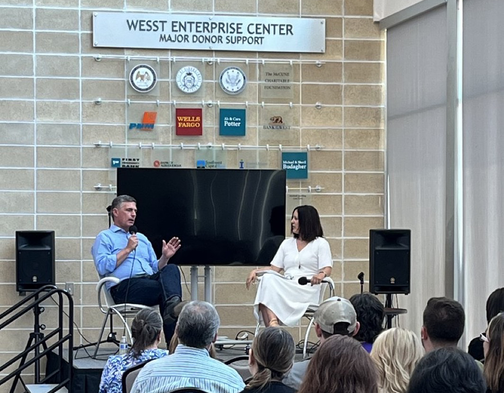 New Mexico Sen. Martin Heinrich and AIandYou CEO Susan Gonzales speaking at WESST about AI.